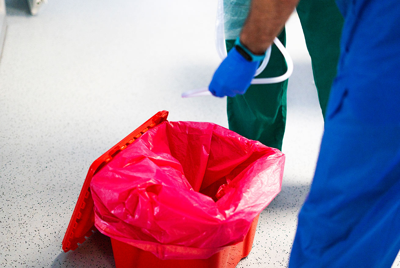 Healthcare professional handling medical waste